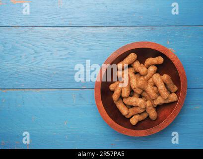 Organic crackers from lentils on a wooden background, space for your text, healthy food Stock Photo