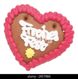 Gingerbread heart with german inscription Merry Christmas on a white background Stock Photo