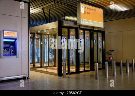 Amsterdam, North Holland, The Netherlands -  April 26 2023. Automatic doors at G and H gate arrivals. Schiphol airport. Stock Photo