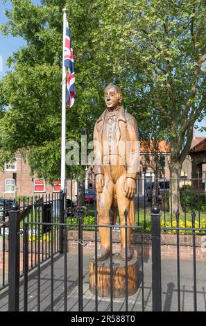 Wooden sculpture or statue of William Bradley the Yorkshire Giant, in Market Weighton, East Riding of Yorkshire, England, UK Stock Photo