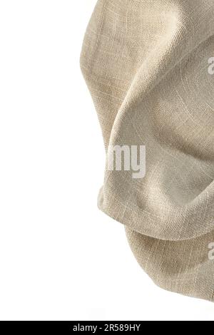Rough beige linen napkin isolated on white background. Top view with copy space Stock Photo
