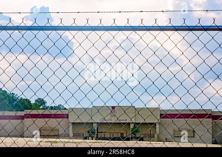 Carmike Cinemas, also known as Carmike 14, sits abandoned behind a chain-link fence, May 31, 2023, in Mobile, Alabama. Stock Photo