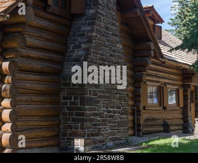 An historic log cabin on the Whyte Museum property in downtown Banff, Alberta, Canada. Stock Photo