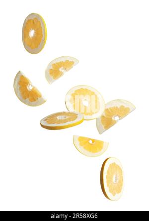 Fresh pomelo fruit slices falling on white background Stock Photo