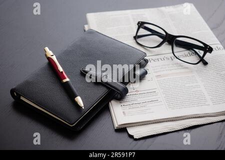 English-language newspapers and business accessories Stock Photo