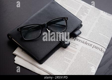 English-language newspapers and business accessories Stock Photo