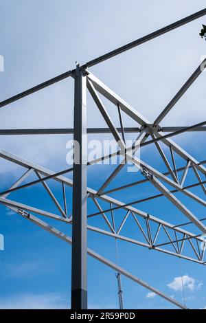 White painted steel beams and girders of a warehouse under construction ...