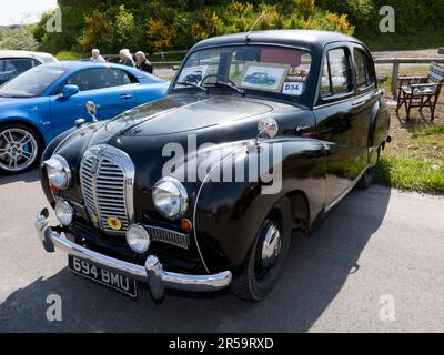 Three-quarters front view of a Black, 1955,  Austin A40 1.2 Somerset on display at the 2023 Deal Classic Car Show Stock Photo