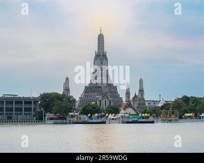 Wat Arun or Temple of Dawn, located on Chao Phraya riverbank at the heart of Bangkok. One of the most remarkable place of Thailand. Stock Photo