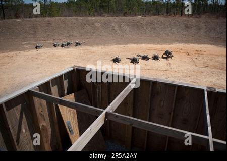 Soldiers in basic training move tactically as a squad during close ...