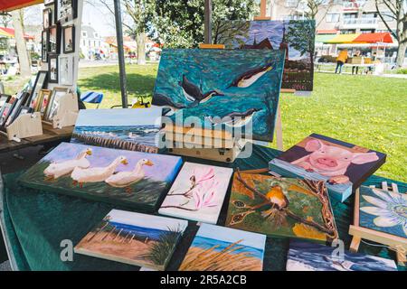 04.18.2023 Hillegom, Netherlands. Paintings with animals and nature sold by Dutch artist at a Hillegom market. Outdoor activities in the Netherlands. High quality photo Stock Photo