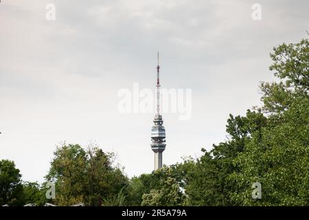 Picture of the Avala tower seen from the nearby forest. The Avala Tower is a 204.68 m tall telecommunications tower located on Mount Avala, in Belgrad Stock Photo