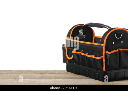 Empty bag for tools on wooden table against white background Stock Photo