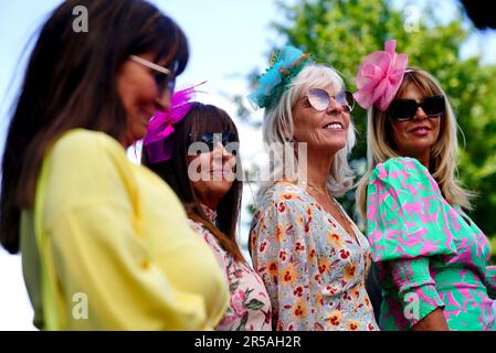 Racegoers pose for a photo as they arrive ahead of ladies day of the 2023 Derby Festival at Epsom Downs Racecourse, Epsom. Picture date: Friday June 2, 2023. Stock Photo