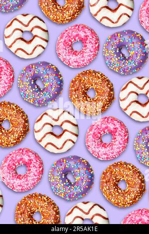Repeating pattern of colorful donuts on a lilac background. Stock Photo