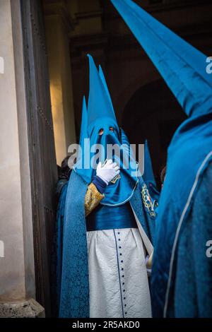 Blue capirote procession during the holy week in Grenada, Spain ...