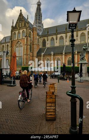 Haarlem, Netherlands - May 24. 2022: Cyclists in the main market sqaure (Grote Markt) in the city center of Haarlem. Stock Photo