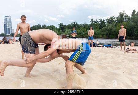 May 27, 2023, Kyiv, Ukraine: Teenagers participate in beach wrestling in Kyiv city during the Russian-Ukrainian war. (Credit Image: © Mykhaylo Palinchak/SOPA Images via ZUMA Press Wire) EDITORIAL USAGE ONLY! Not for Commercial USAGE! Stock Photo