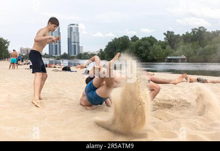 May 27, 2023, Kyiv, Ukraine: Teenagers participate in beach wrestling in Kyiv city during the Russian-Ukrainian war. (Credit Image: © Mykhaylo Palinchak/SOPA Images via ZUMA Press Wire) EDITORIAL USAGE ONLY! Not for Commercial USAGE! Stock Photo