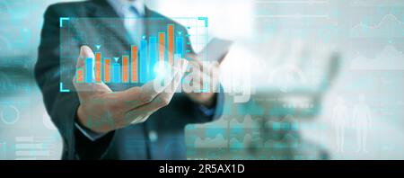 Business Analytics and Data Management System. A Businessman Holds and Presents a Financial Graph, Chart, Report from the Database for Finance, Operat Stock Photo