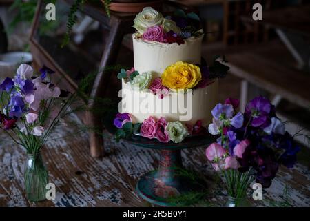 Wedding cake decorated with flowers. Stock Photo