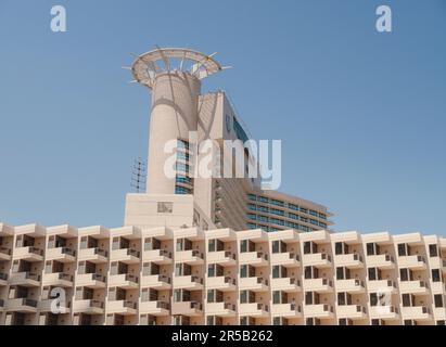 Abu Dhabi, UAE - March 19, 2023: Abu Dhabi Mall and Beach Rotana Hotel. View from the water, of the Beach Rotana Hotel and the Abu Dhabi Mall, with reflections. Stock Photo