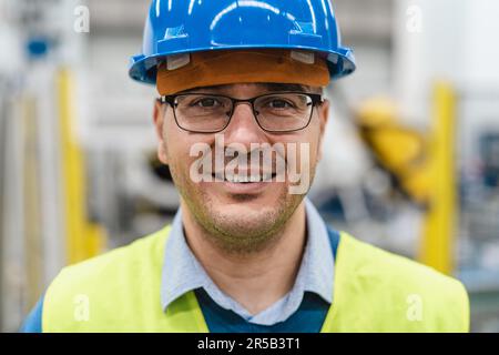 Engineer man working inside robotic factory - Automation industry concept Stock Photo