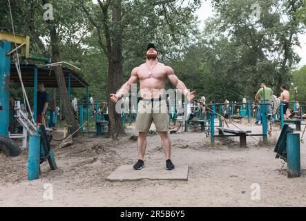 Kyiv, Ukraine. 27th May, 2023. A man seen exercising in soviet-era outdoor gym Kachalka, Kyiv park. Despite daily missile attacks on Ukraine's capital Kyiv, life goes on. People relax and exercise in the parks outdoor sports areas. (Photo by Mykhaylo Palinchak/SOPA Images/Sipa USA) Credit: Sipa USA/Alamy Live News Stock Photo