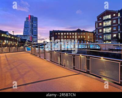 UK, West Yorkshire, Leeds, David Oluwale Bridge crossing the River Aire with Bridgewater Place otherwise known as The Dalek in the background. Stock Photo