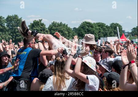 Nuremberg, Germany. 02nd June, 2023. A festivalgoer crowdsurfing during the performance of the British rock band Nothing But Thieves at the open-air festival Rock im Park in front of the Utopia Stage. Credit: Daniel Vogl/dpa/Alamy Live News Stock Photo