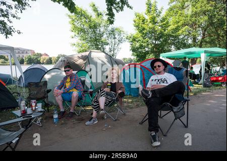 Nuremberg, Germany. 02nd June, 2023. A group of visitors sits in their camping chairs during the Rock im Park open-air festival at the campsite. About 60,000 visitors are expected at the festival. Credit: Daniel Vogl/dpa/Alamy Live News Stock Photo