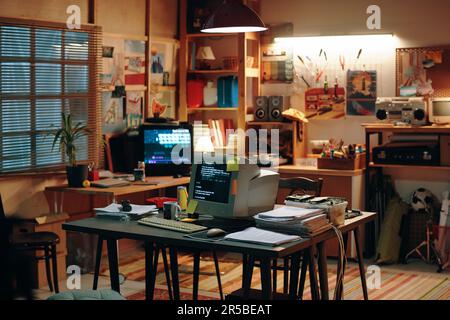 Garage with computers on table for developing new idea in IT technology Stock Photo