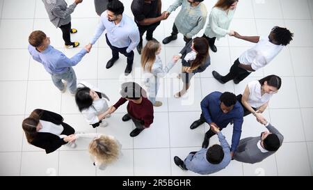 Group company confidently passes through the office hall Stock Photo