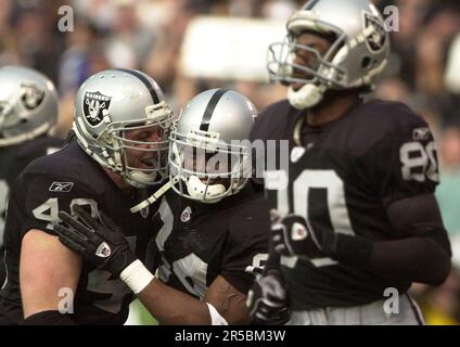 RAIDERS38-C-12JAN03-SP-PC Raiders #40 Jon Ritchie celebrates with #84 Jerry  Porter after Porter's third quarter touchdown. The Oakland Raiders play the  New York Jets in an AFC playoff game at the Oakland Coliseum