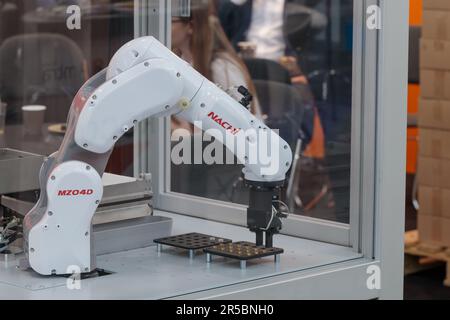 Robot arm, technology cycle, automated process, Europe ITM, HIGH TECH SHOW. Stock Photo