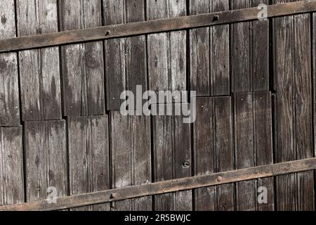 Weathered Old Barn Door Made of Pinewood Planks Stock Photo
