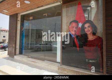 Nablus, Palestine. 02nd June, 2023. View of a poster of King Abdullah II of Jordan and his wife Queen Rania on a Palestinian store, during the occasion of their son Prince Hussein's wedding, in the middle of the market in the city of Nablus, north of the occupied West Bank (Photo by Nasser Ishtayeh/SOPA Images/Sipa USA) Credit: Sipa USA/Alamy Live News Stock Photo