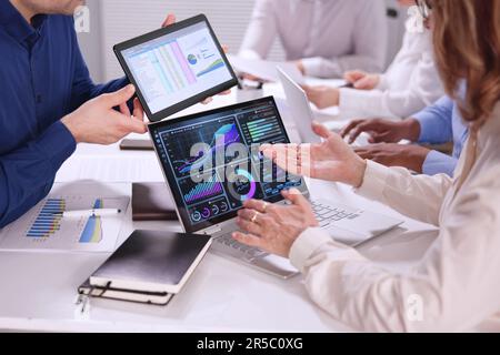 Business People Working On Dashboard Using Computer And Spreadsheet Stock Photo
