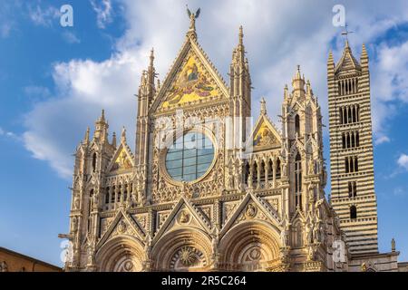 Siena, Siena Province, Tuscany, Italy.  The Romanesque-Gothic duomo, or cathedral, built in the 13th century.  Metropolitan Cathedral of Saint Mary of Stock Photo