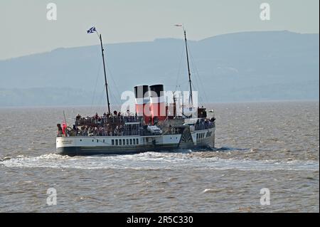 Clevedon, UK. 02nd June, 2023. On a very hot afternoon the Only Worlds Last Paddle Steamer is seen picking up queues of passengers from Clevedon Pier, the only Grade 1 Listed operational Pier in England. Picture Credit: Robert Timoney/Alamy Live News Stock Photo