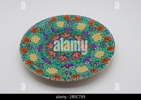 Hand painted plate isolated on white background Stock Photo