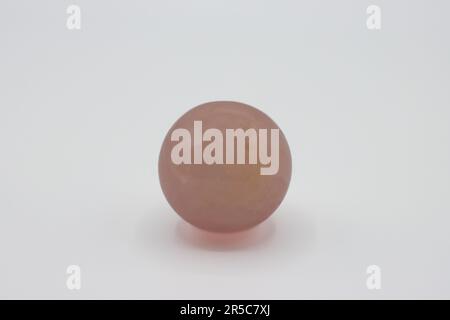 Pink Quartz sphere isolated on white background Stock Photo