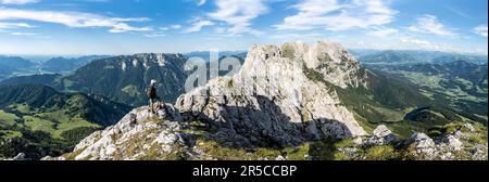 Panorama, mountaineers on a ridge trail, crossing the Hackenkoepfe, rocky mountains of the Kaisergebirge, behind Zahmer Kaiser, Wilder Kaiser Stock Photo