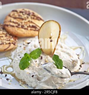 Pear, cream, ricotta and honey mousse Stock Photo