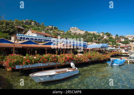 Kale Castle and Excursion Restaurants, Riviera, Simena, Lycia, Turkish South Coast, Turkey Stock Photo