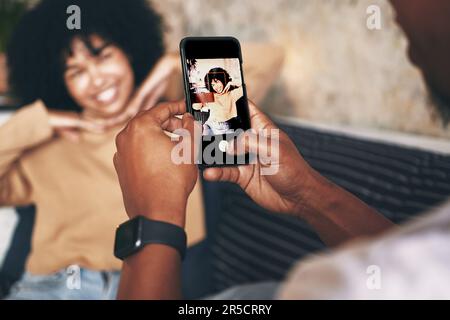 Social media deserves to see this. a young woman posing while her boyfriend takes photos at home. Stock Photo