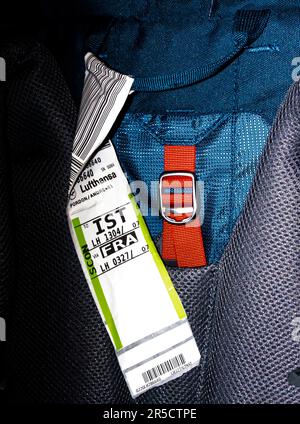 A suitcase with an airline baggage rucksack backpack tag shows the three letter airport code for IST - Istanbul airport - FRA France Stock Photo