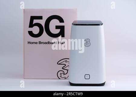 Three network ZYXEL NR5103E 5G WIFI ROUTER isolated on white next to the box it is supplied. 5G Home Broadband Hub. Stafford, United Kingdom, June 2, Stock Photo