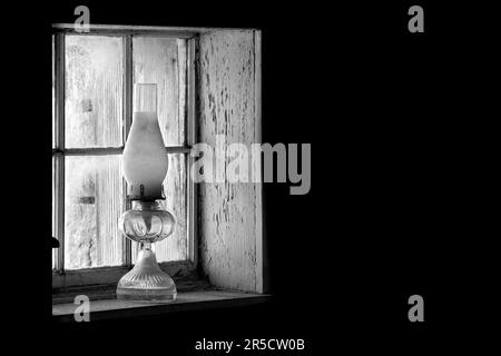 In the late 1800's natural light, through a window or from a kerosene lamp in the evening, helped keep ranching operations on track in the old west. Stock Photo