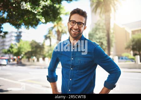 Walking in the city is quite a workout. Closeup shot of a handsome middle-aged man spending the day out in the city. Stock Photo